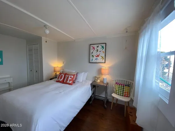 a bedroom with a bed and a table in it