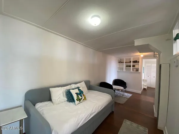 a bedroom with bed and window