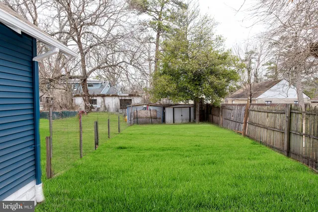 an aerial view of a houses with yard