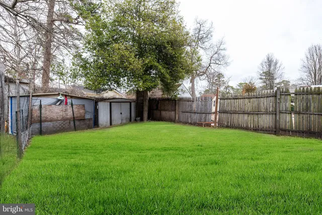 a view of a lake with a house and a park