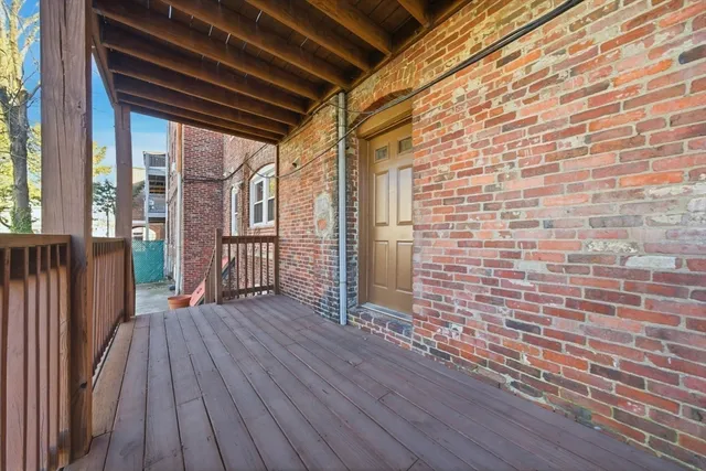 a view of outdoor space with wooden floor