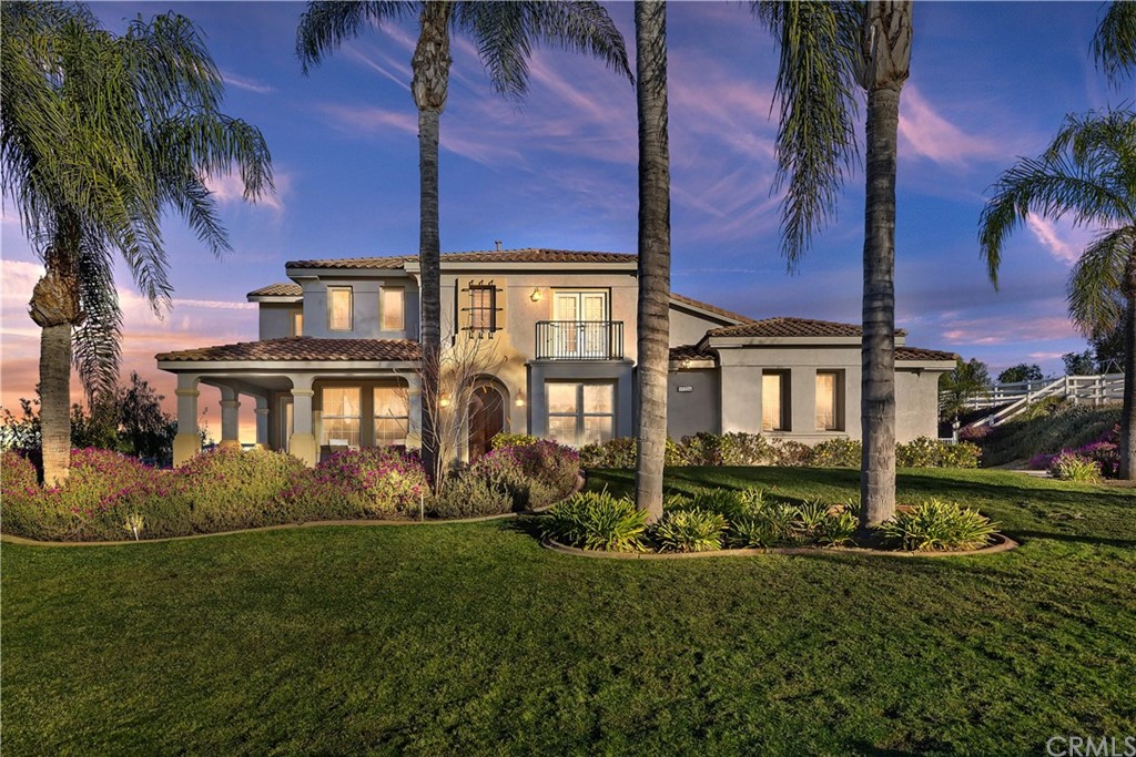 18536 Pinecone Lane Riverside, CA 92504 - Photo 1 of 1 a front view of a house with a garden