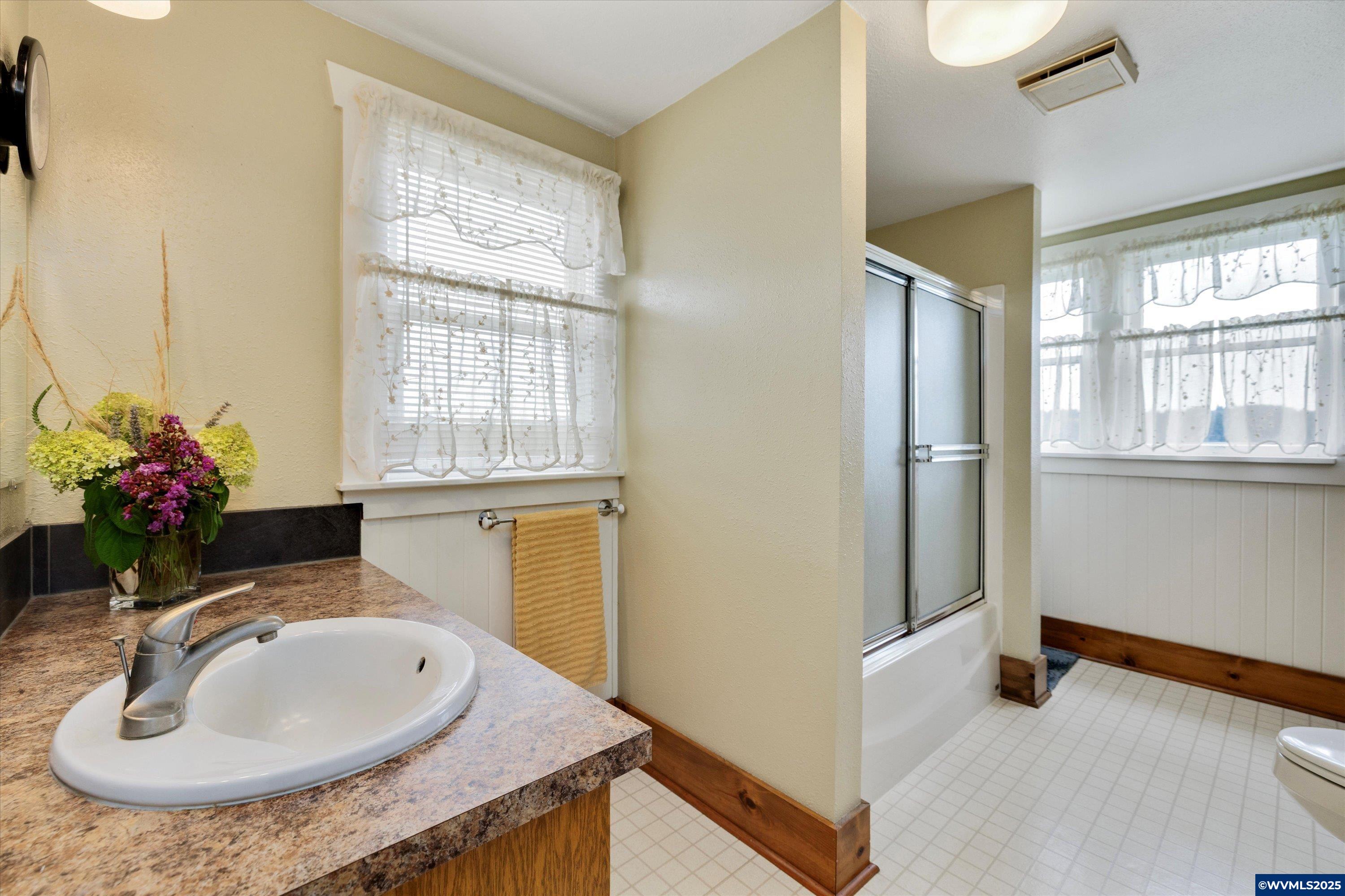21303 South Central Point Road Canby, OR 97013 - Photo 41 of 50 a en suite bathroom with a granite countertop sink and a mirror