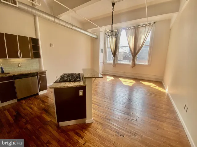 a living room with wooden floor