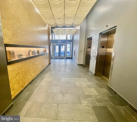 a view of a hallway with a chandelier
