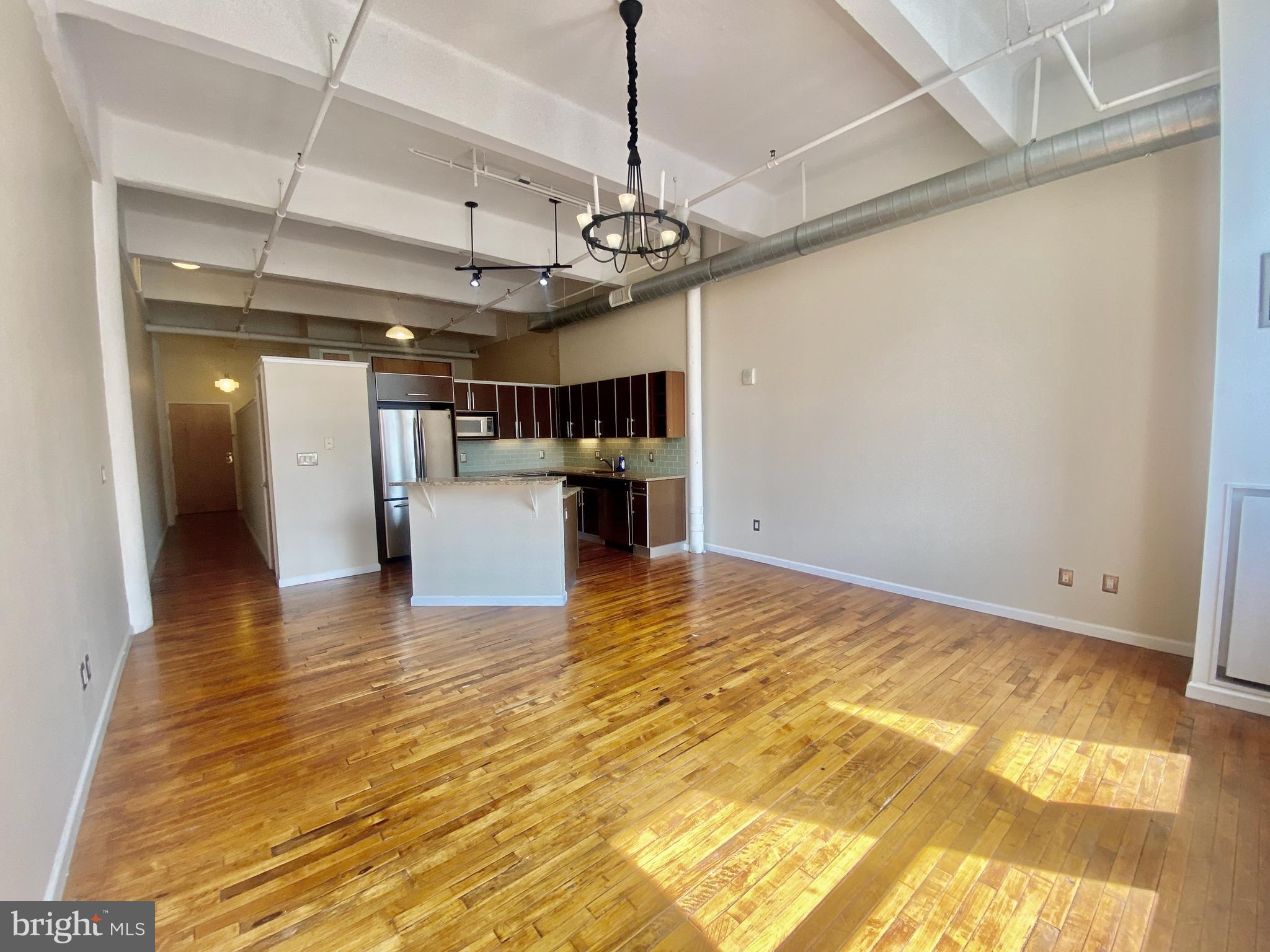 1228-32 Arch Street, Unit 5C Philadelphia, PA 19107 - Photo 23 of 34 a view of a kitchen with a sink and refrigerator