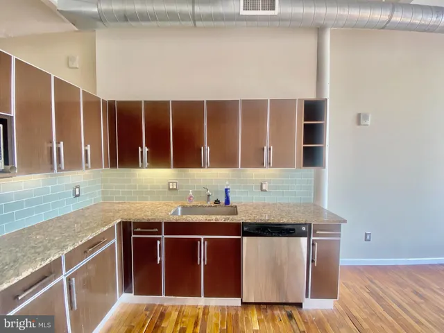 a kitchen with a sink and a window
