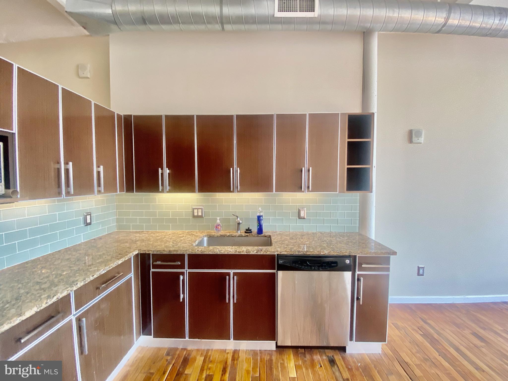 1228-32 Arch Street, Unit 5C Philadelphia, PA 19107 - Photo 29 of 34 a kitchen with a sink and a window