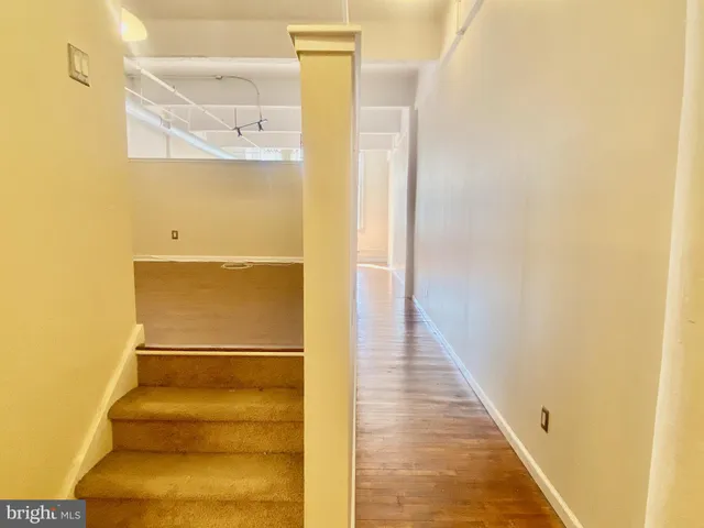 a view of staircase with white door