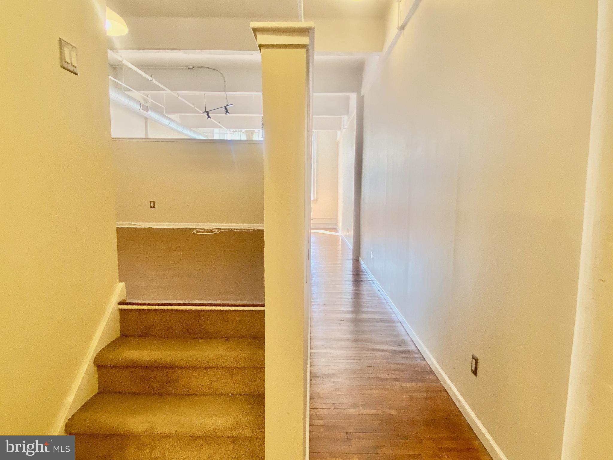 1228-32 Arch Street, Unit 5C Philadelphia, PA 19107 - Photo 4 of 34 a view of staircase with white door
