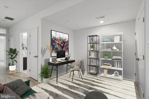 a work room with furniture and wooden floor