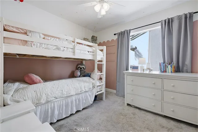 a view of a bedroom with furniture
