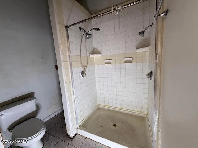 a kitchen with granite countertop a stove a sink and a refrigerator
