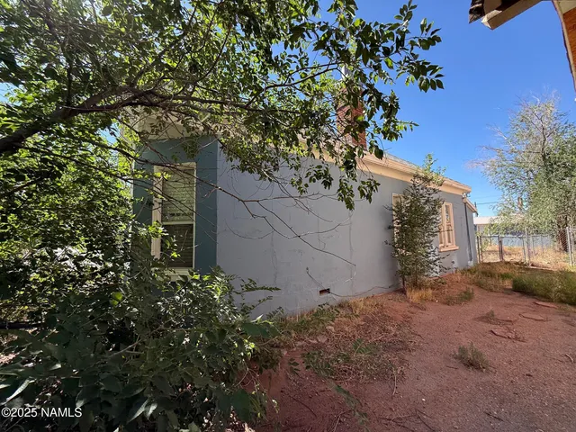 a view of a house with a tree