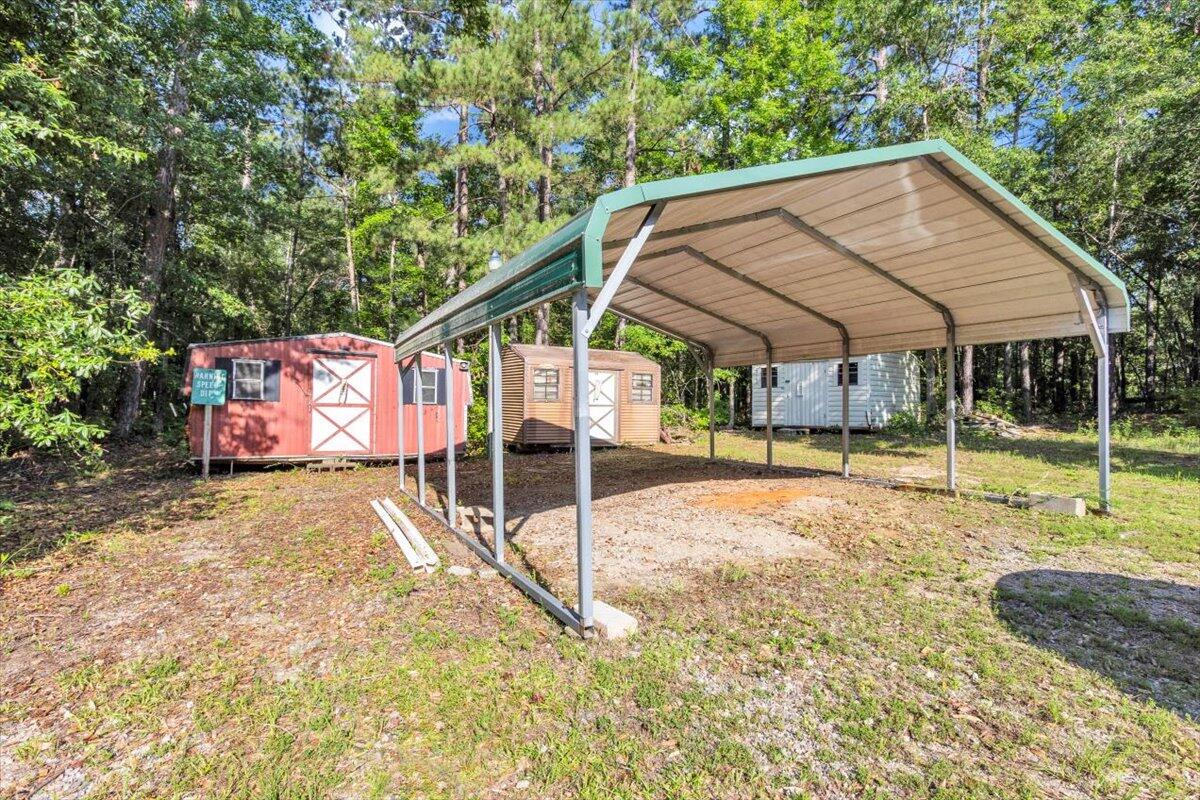 2544 Pineneedle Road Hephzibah, GA 30815 - Photo 12 of 49 Double carport with view of shed #2 ,#3 and #4