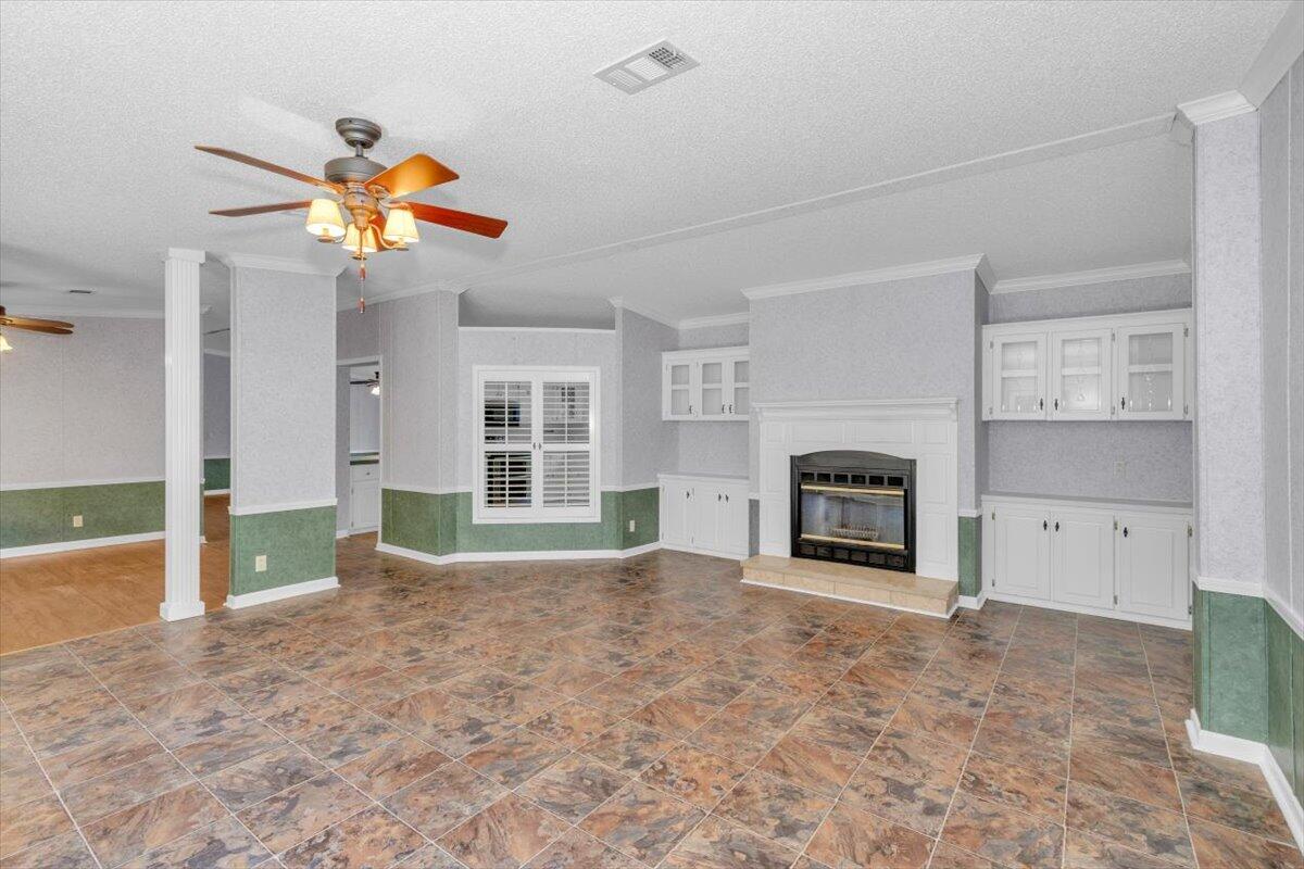 2544 Pineneedle Road Hephzibah, GA 30815 - Photo 16 of 49 Fireplace with built ins. View of dining room to the left.
