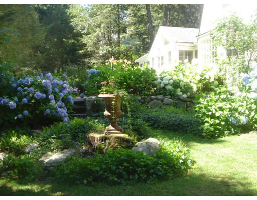 18 Woodridge Road Wellesley, MA 02482 - Photo 13 of 20 a view of a garden with plants and large trees