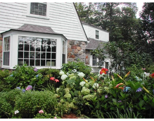 18 Woodridge Road Wellesley, MA 02482 - Photo 18 of 20 a house view with a garden space