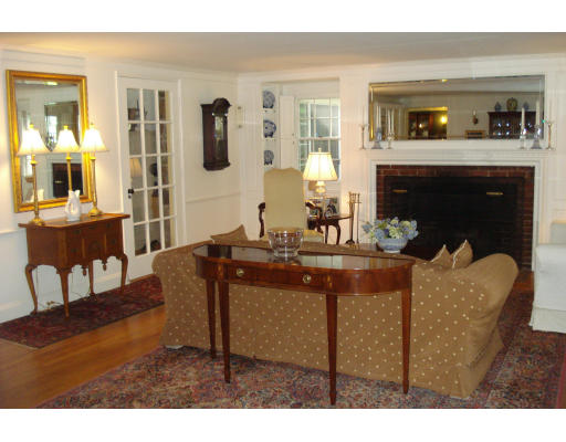 18 Woodridge Road Wellesley, MA 02482 - Photo 2 of 20 a living room with furniture and a fireplace