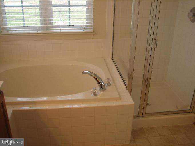 215 Maddex Square Drive Shepherdstown, WV 25443 - Photo 11 of 16 a close up of a bathtub
