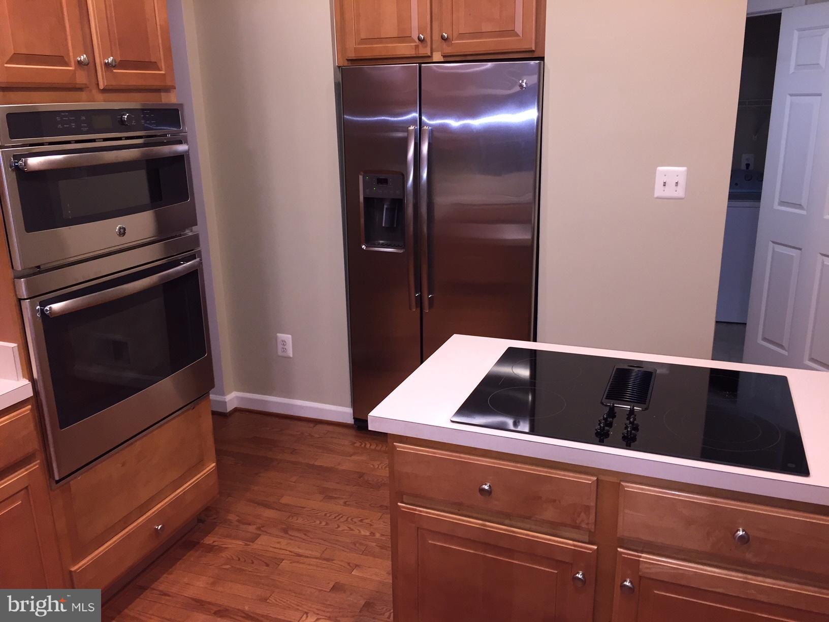 215 Maddex Square Drive Shepherdstown, WV 25443 - Photo 4 of 16 a close view of kitchen countertops and fireplace