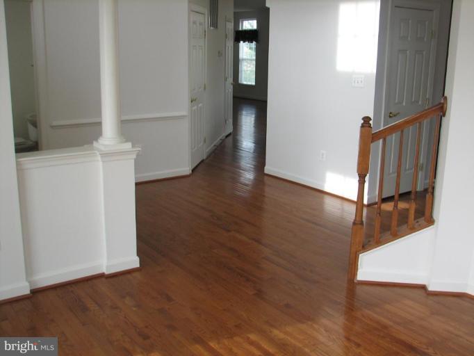 215 Maddex Square Drive Shepherdstown, WV 25443 - Photo 6 of 16 a view of a hallway with wooden floor