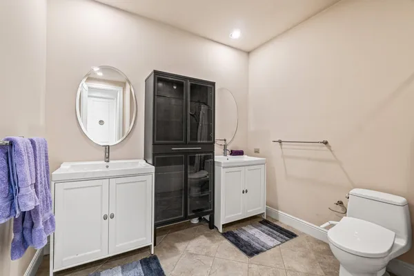 a view of a bedroom with wooden floor and cabinet