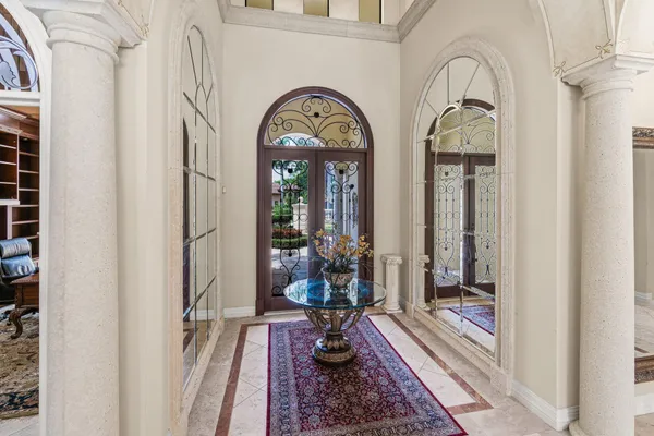 a living room with lots of furniture and a chandelier