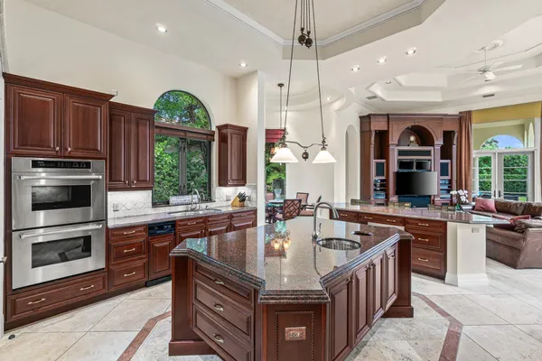 a living room with furniture tv and a large window