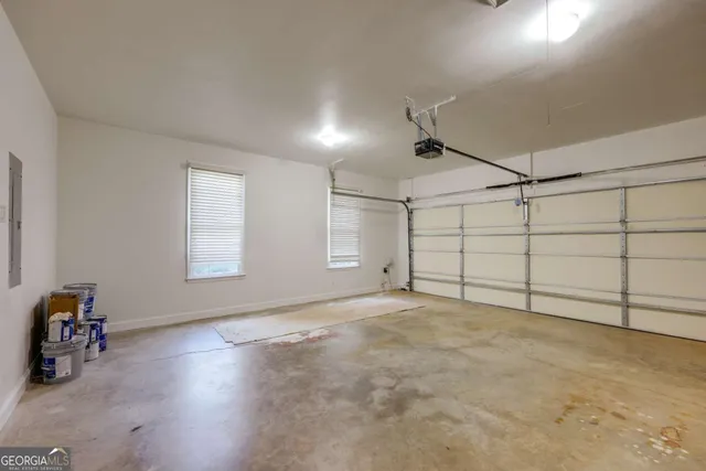 a view of a yard with plants and trees