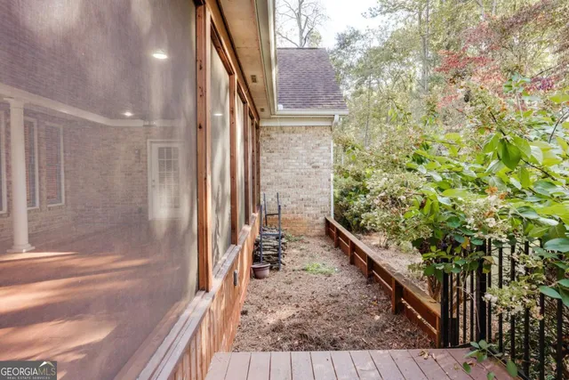 a view of a backyard with large trees