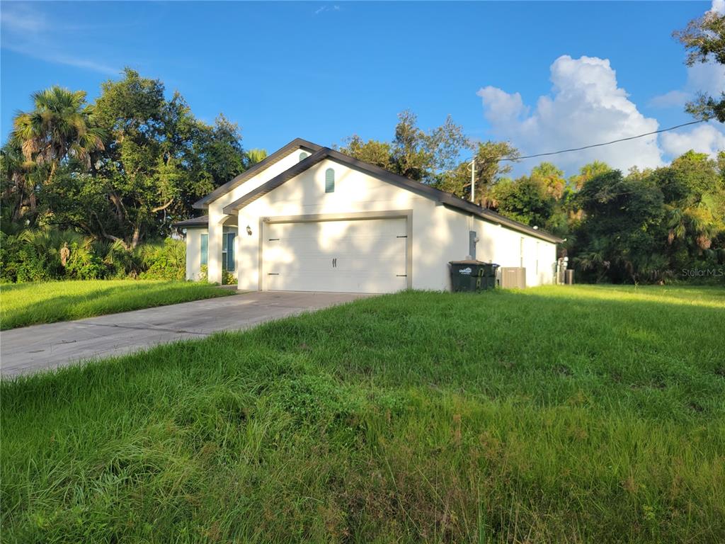 2350 Firebrand Road North Port, FL 34288 - Photo 5 of 6 a front view of a house with garden