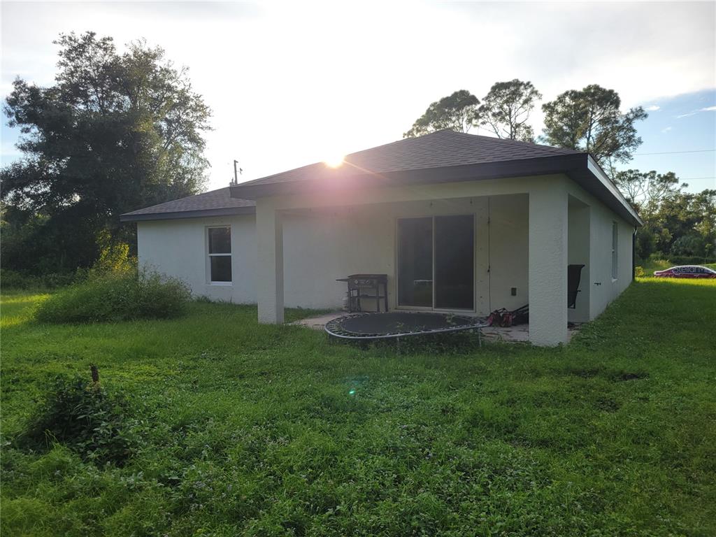 2350 Firebrand Road North Port, FL 34288 - Photo 6 of 6 a view of a house with a yard and a porch