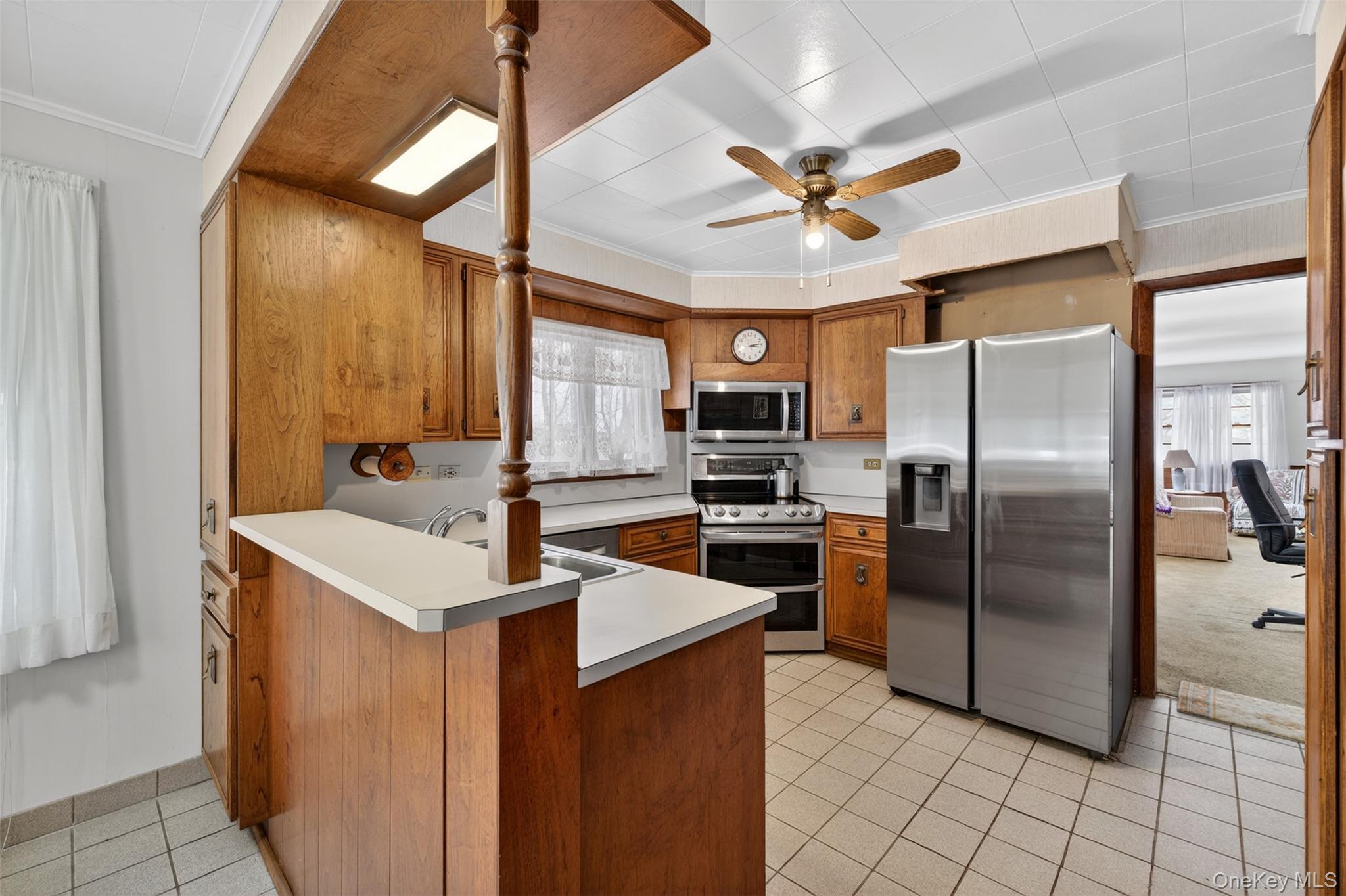 191 Rose Road Woodbourne, NY 12788 - Photo 12 of 47 Kitchen with stainless steel appliances, wood cabinets and a breakfast bar