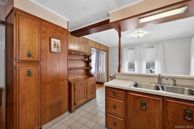 a bathroom with a sink a mirror and a shower