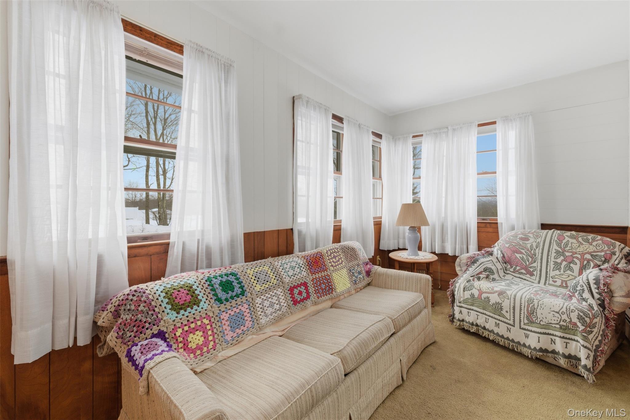 191 Rose Road Woodbourne, NY 12788 - Photo 14 of 47 Additional living space with beautiful views of the back yard and surrounding areas. An ideal spot for reading a book, a home office or a playroom