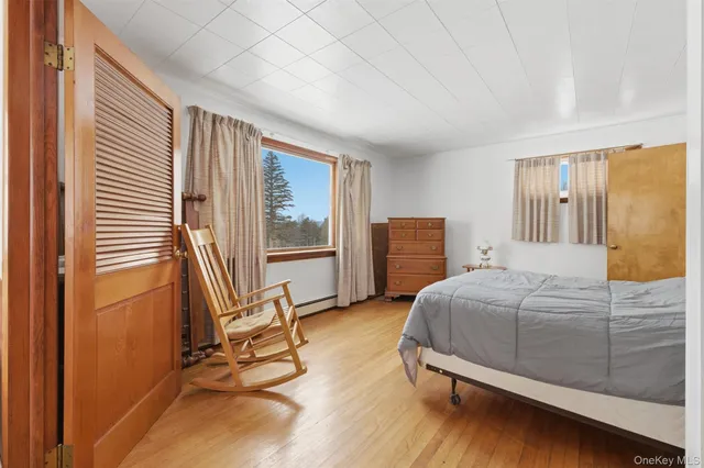 a bedroom with a bed and a table