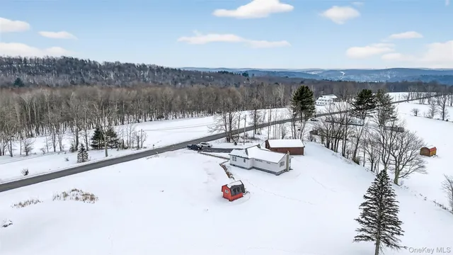 a view of a road with a building in the background