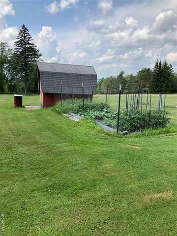 a view of a lake with houses in the back