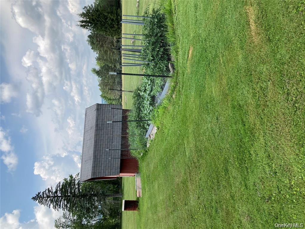 191 Rose Road Woodbourne, NY 12788 - Photo 40 of 47 View of green lawn with a garden and a shed