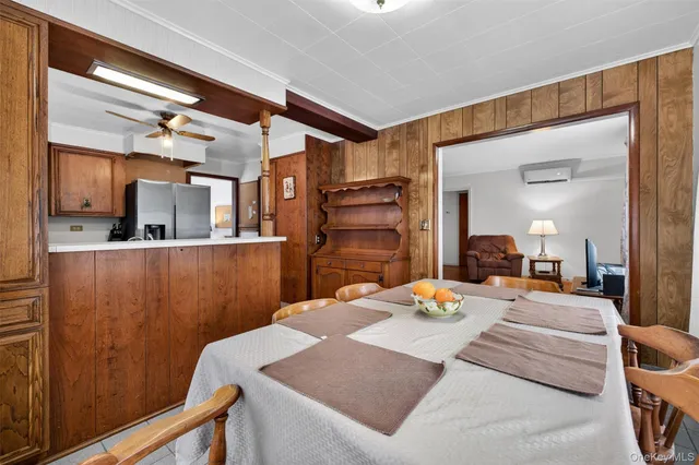 a bedroom with a bed and a mirror