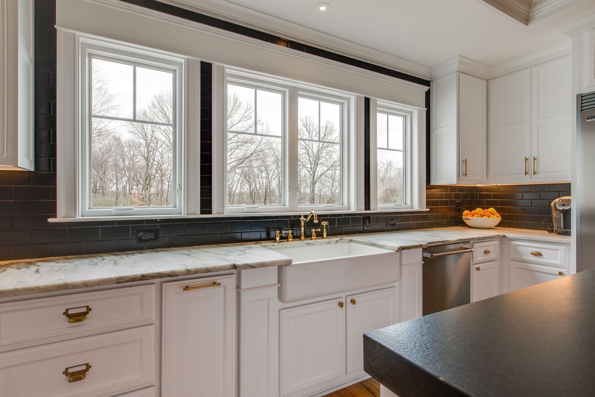 4280 Warren Road Franklin, TN 37067 - Photo 20 of 50 a kitchen with granite countertop white cabinets and white appliances