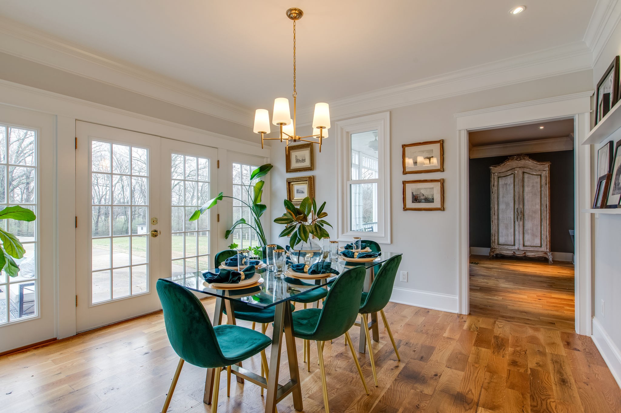 4280 Warren Road Franklin, TN 37067 - Photo 22 of 50 a dining room with furniture a chandelier and wooden floor
