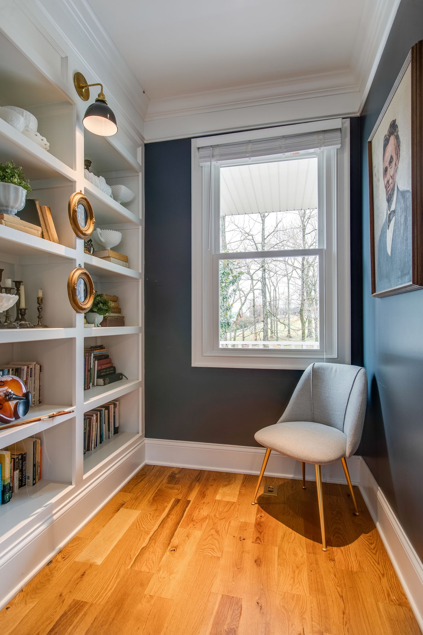 4280 Warren Road Franklin, TN 37067 - Photo 27 of 50 a living room with a couch and a bookshelf