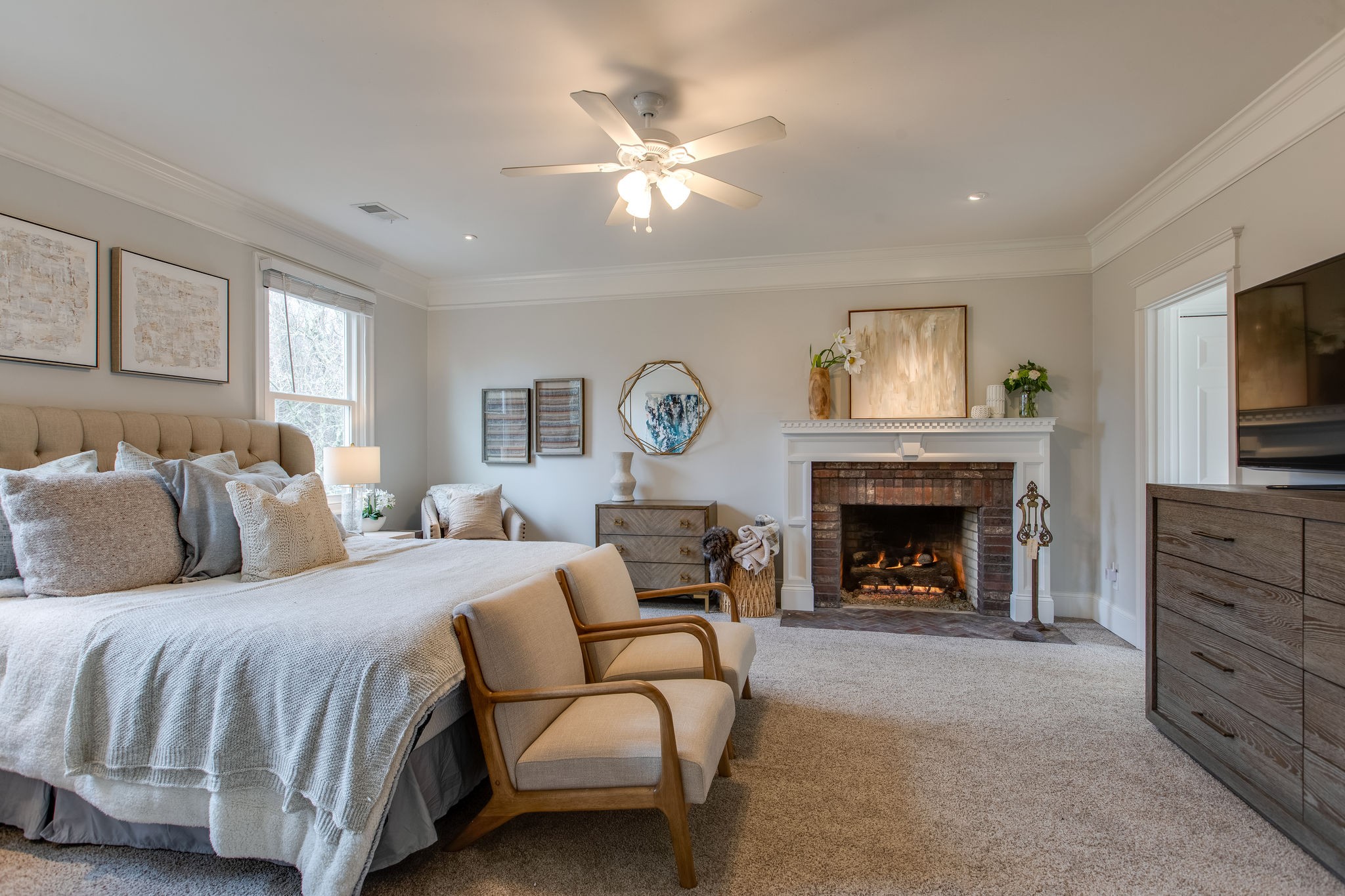 4280 Warren Road Franklin, TN 37067 - Photo 33 of 50 a spacious bedroom with a large bed and a fireplace