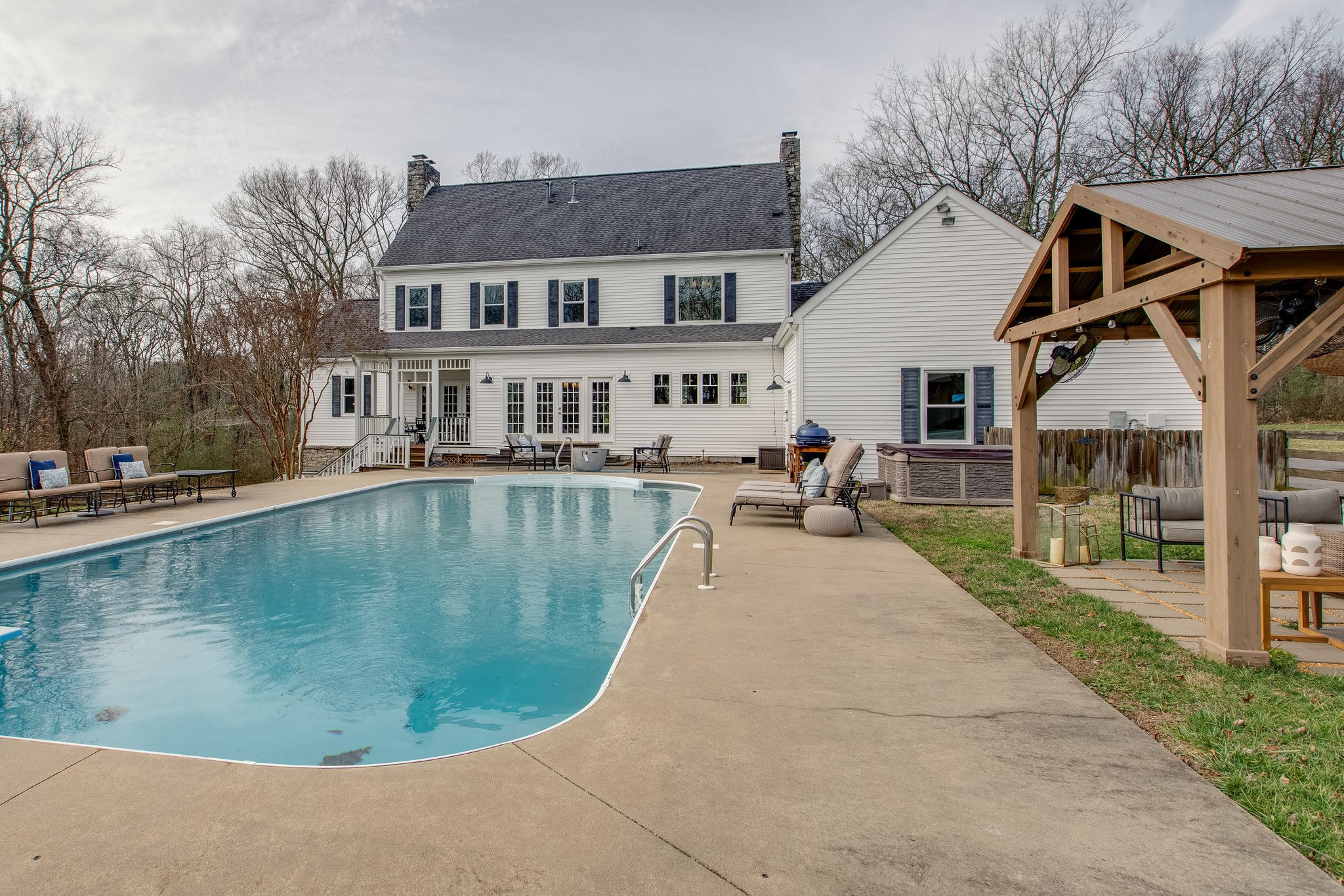 4280 Warren Road Franklin, TN 37067 - Photo 47 of 50 a view of a white house with swimming pool in front of it