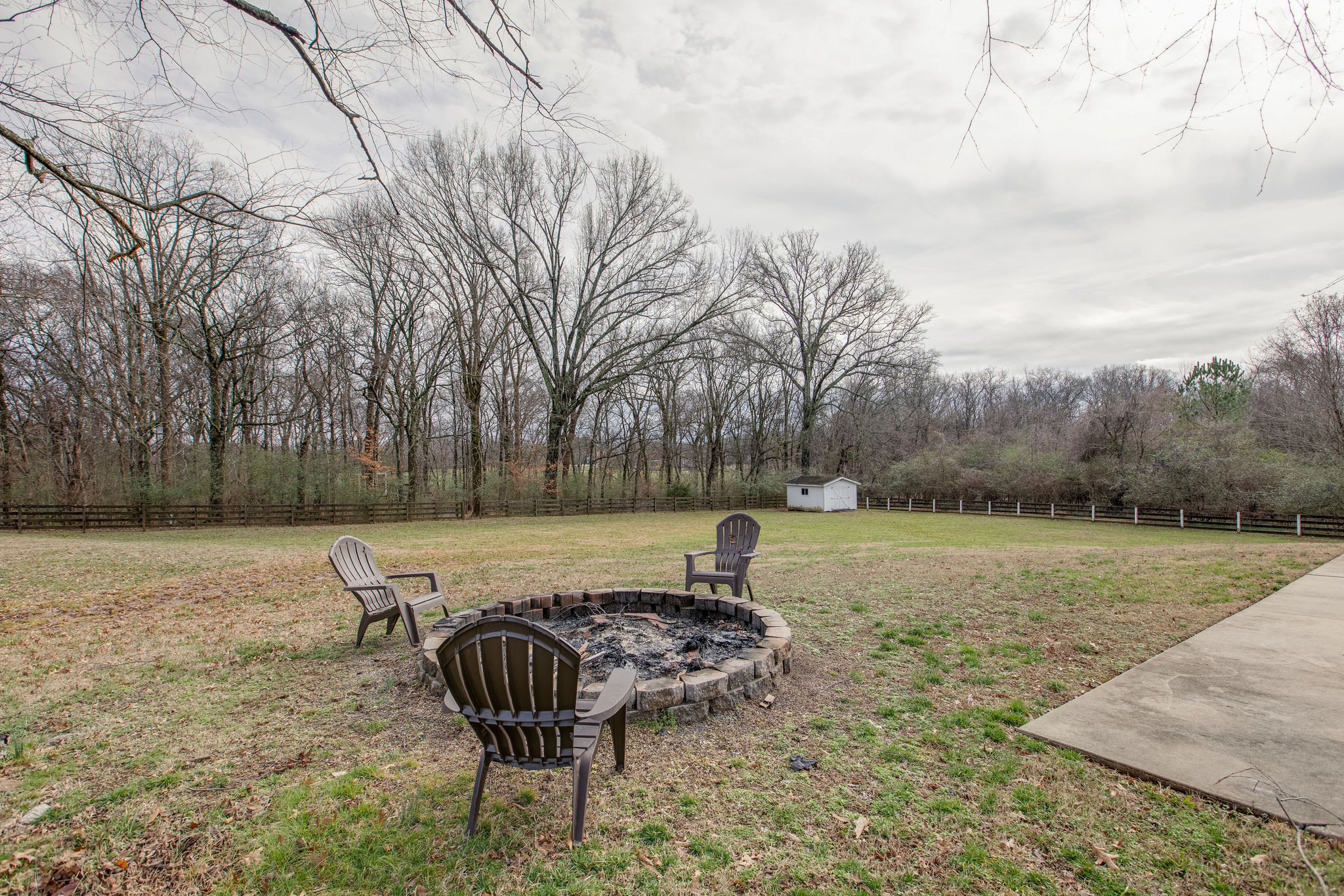 4280 Warren Road Franklin, TN 37067 - Photo 49 of 50 a backyard of a house with lots of green space and trees