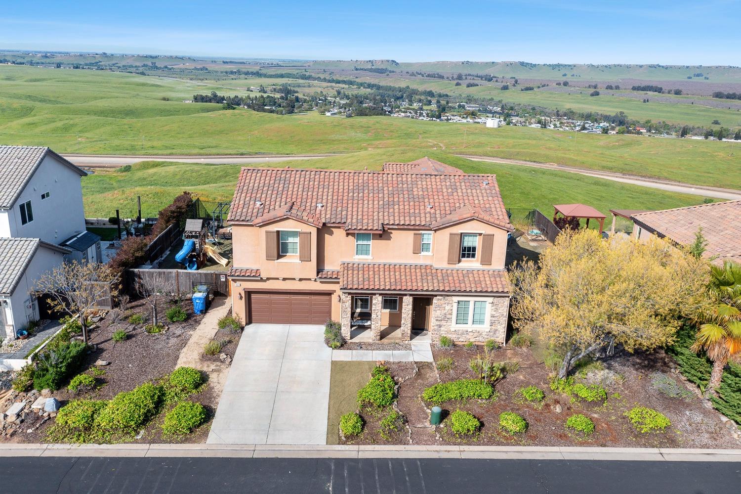 an aerial view of a house with a garden