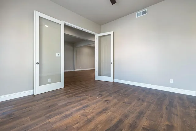 a view of an empty room with a window