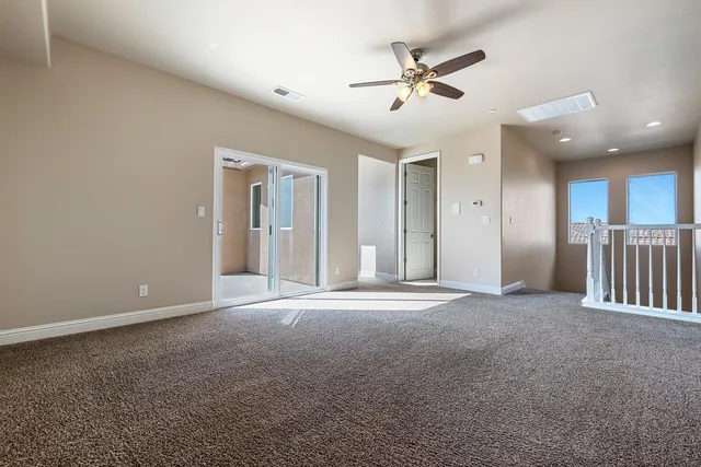 a spacious bathroom with a granite countertop tub sink shower and mirror